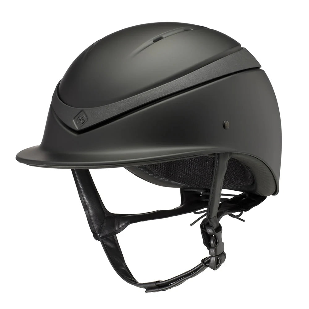 Black Luna riding helmet on a white background. Charles Owen England helmets available with Nice Equestrian Wukair Doha Qatar. One of the highest safeties ranked helmets in the world.