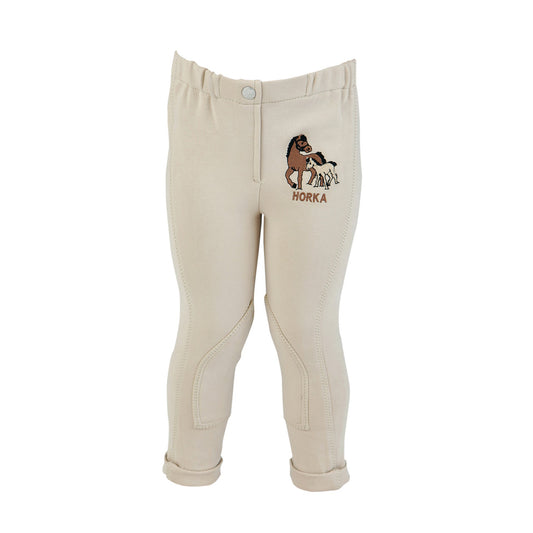 Horka White riding breeches for children with a logo of a horse on the left leg.
Horka. Mini Riding Breeches. Available at Nice equestrian Wukair Doha Qatar.