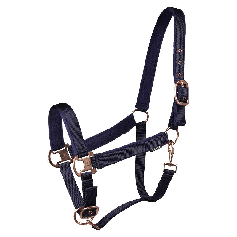 A navy-blue horse halter with adjustable buckles and soft fleece lining on the headpiece and noseband. Halter. Horka. Available with Nice equestrian. Wukair. Doha. Qatar.
