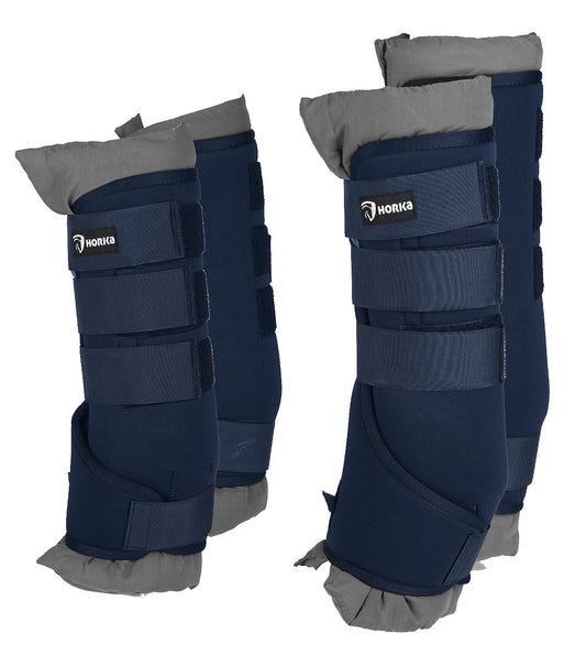 A pair of blue horse boots with straps and padding, designed for travel and stable use. Horka. Available with Nice Equestrian Wukair Doha Qatar