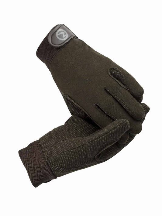 A pair of brown, adjustable Horze Polygrip Gloves with rubber stubble on the palm and fingers.
Available at Nice Equestrian Wukair Doha Qatar.