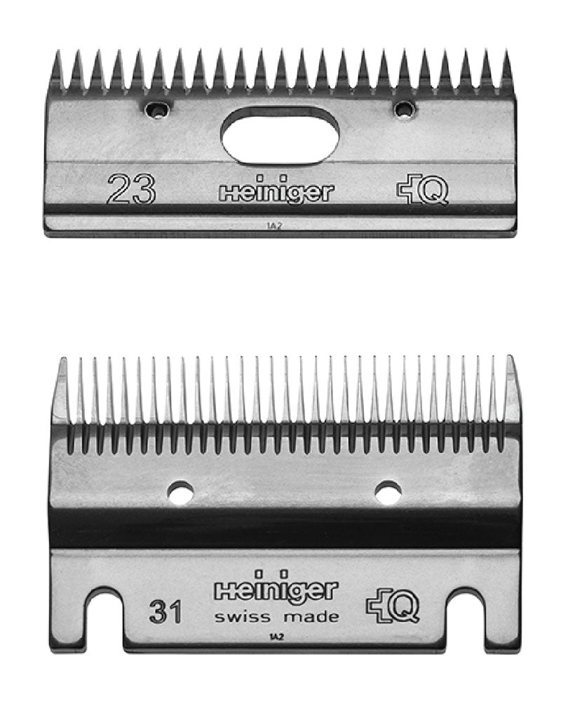 Two silver metal shearing knife blades with 'Heiniger' and 'Swiss made' text, numbers '31' and '23', and a quality assurance symbol.
Available at Nice equestrian Wukair Doha Qatar.