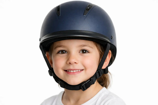 Child wearing a correctly fitted riding helmet in Qatar — safety guide for parents