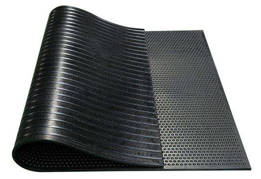 A black rubber stable mat with a textured surface designed for use in horse stables. Made in China. Available with Nice equestrian Wukair Doha Qatar.