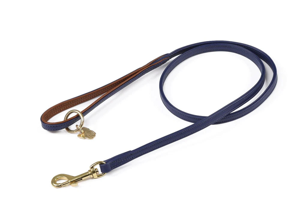 Navy blue dog leash with gold clasp on a white background
Digby & Fox Padded Leather Dog Lead
Available in Nice Equestrian Wukair Doha Qatar
