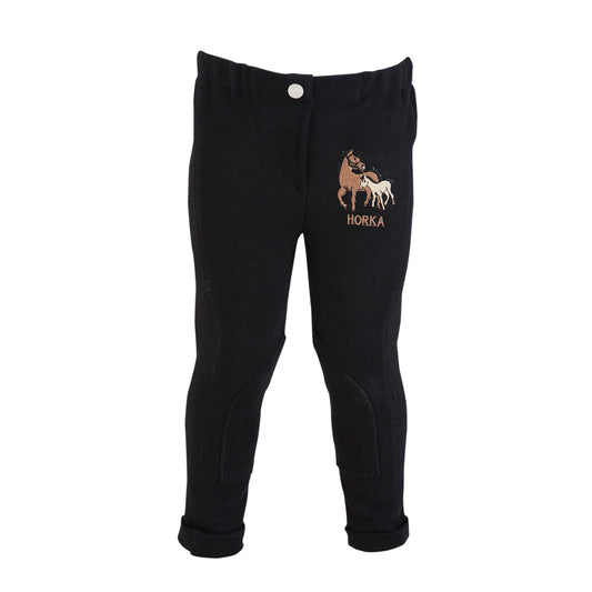 Black riding breeches for children with a logo of a horse on the left leg.
Horka. Mini Riding Breeches. Available at Nice equestrian Wukair Doha Qatar.