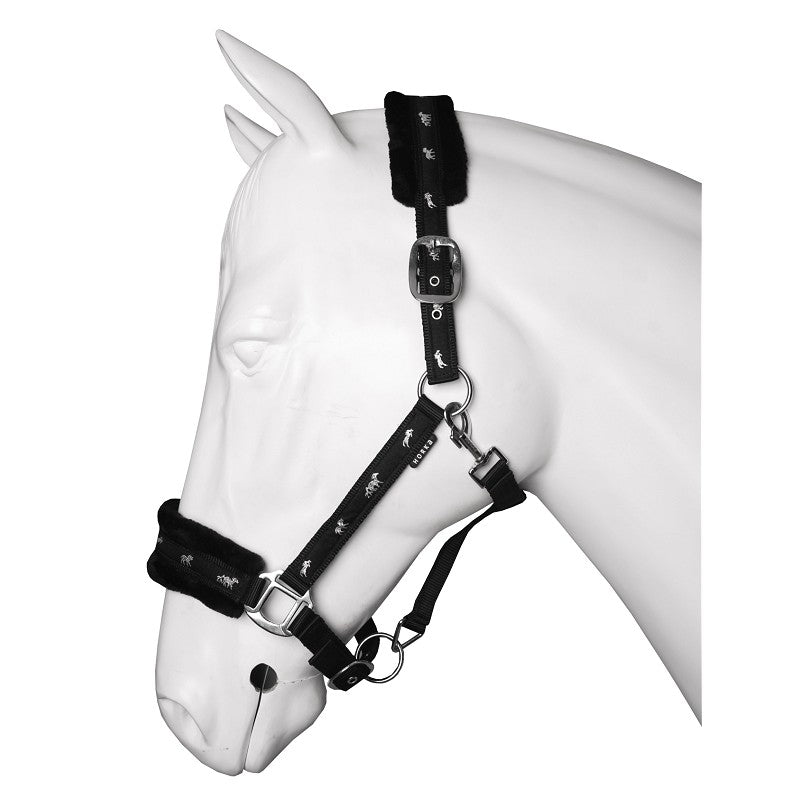 A plush Black horse halter with soft fur lining on the noseband and headpiece, displayed on a white horse mannequin. Horka. Available with Nice Equestrian Wukair Doha Qatar