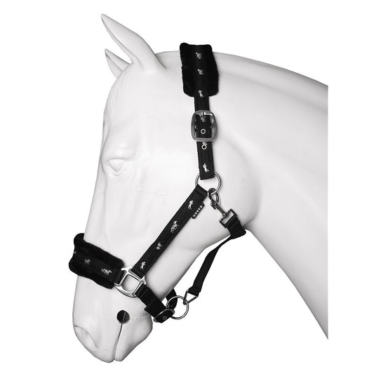 A plush Black horse halter with soft fur lining on the noseband and headpiece, displayed on a white horse mannequin. Horka. Available with Nice Equestrian Wukair Doha Qatar