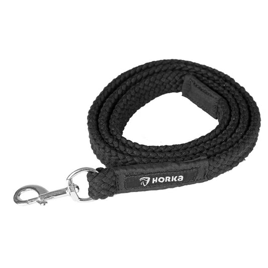 A black flat braided lead rope with a carabiner, and the brand 'HORKA' visible on the rope.
Horka. Available at Nice equestrian Wukair Doha Qatar.