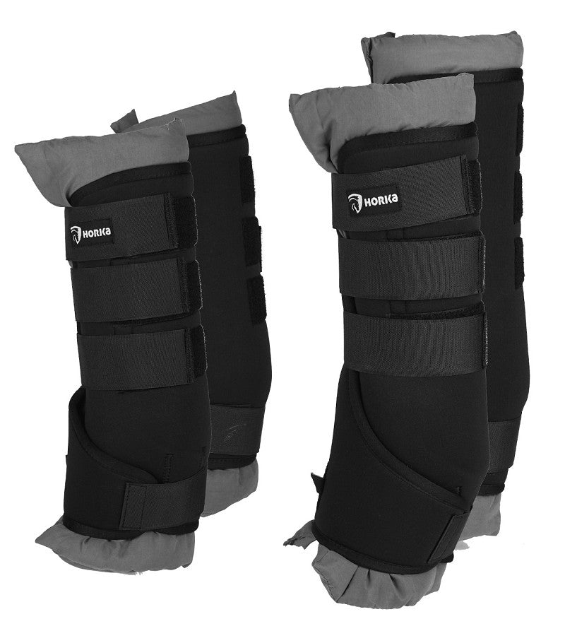 A pair of black horse boots with straps and padding, designed for travel and stable use. Horka. Available with Nice Equestrian Wukair Doha Qatar