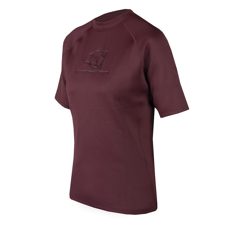 A Horka brown equestrian pro embossed shirt with short sleeves and a small stand-up collar, displayed on a mannequin.
Available at Nice Equestrian Wukair Doha Qatar