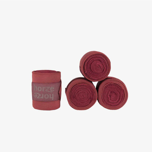 A set of red Horze Nesti Comb Bandages, which include fleece wraps and stretch sections for comfort and security.
Horze. Available at Nice Equestrian Wukair Doha Qatar