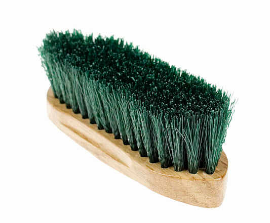 A small dandy brush with green synthetic bristles and a wooden back, with the Horze logo printed on the back.
Available at Nice Equestrian Wukair Doha Qatar.