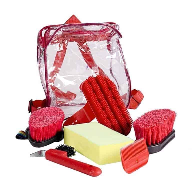 A set of horse grooming tools including brushes, a hoof pick, a mane comb, and a sponge, all in red, blue, black, and beige colors, displayed alongside a clear carrying bag.
Horze. Available at Nice Equestrian. Doha. Qatar.