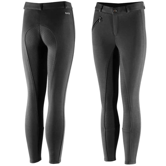 A pair of kids' riding breeches featuring silicone grip print at the seating area, a front zipper pocket, and elastic leg bottoms in a solid black color.
Horze. Breeches.
Available at Nice Equestrian Wukair Doha Qatar