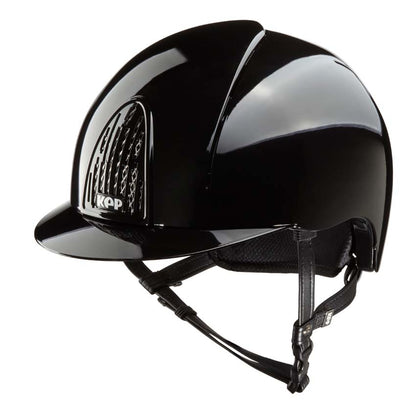 A KEP black equestrian helmet with a glossy finish, featuring a visor and adjustable straps.  KEP Italy helmets available with Nice Equestrian Wukair Doha Qatar. One of the top ranked helmets in the world