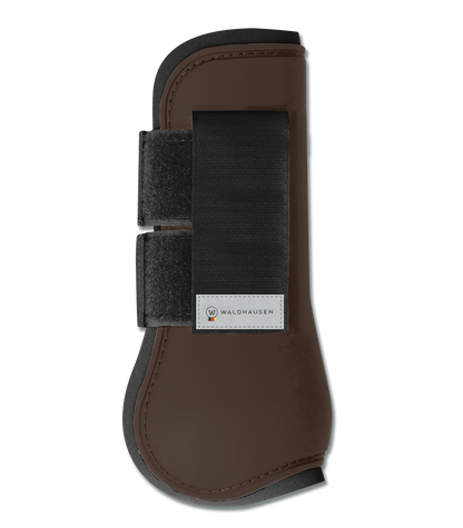 A brown horse tendon boot with black straps and a hard-shell exterior, designed for leg protection
