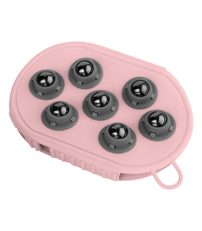A pink grooming glove with rubber nobs on one side and massage balls on the other, designed for horse care.