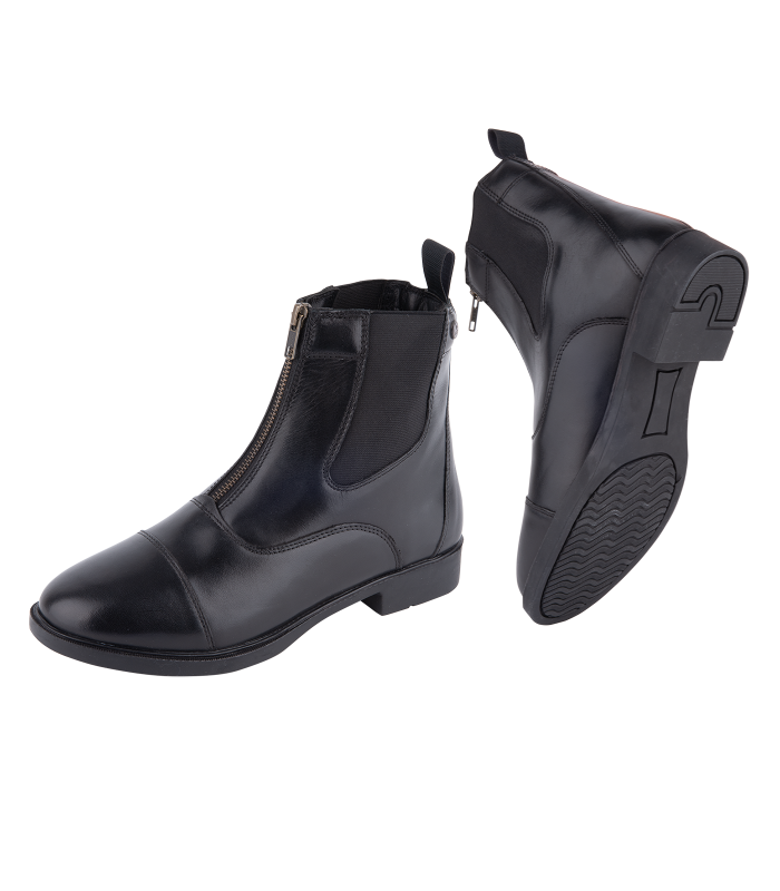 A pair of black jodhpur boots with a zip on the front, designed for equestrians.