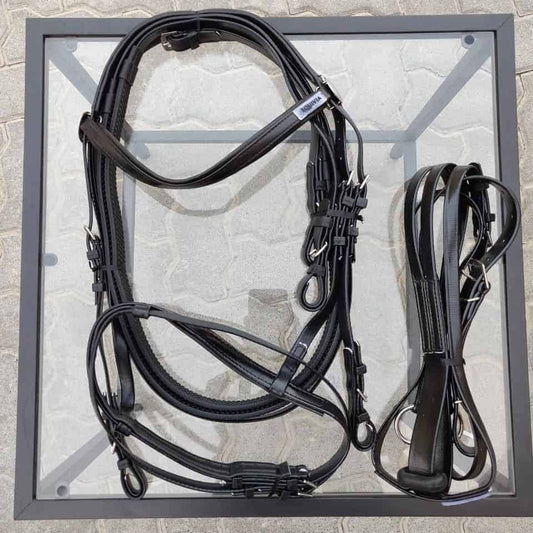 A black plastic bridle set by Equivia displayed on a grey background, including the headstall, reins, and martingale.
Horze. Equivia.
Available at Nice Equestrian Wukair Doha Qatar