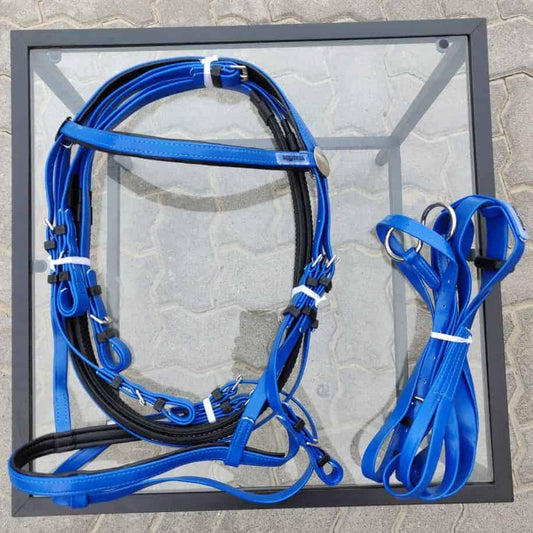 A blue plastic bridle set by Equivia displayed on a grey background, including the headstall, reins, and martingale.
Horze. Equivia.
Available at Nice Equestrian Wukair Doha Qatar