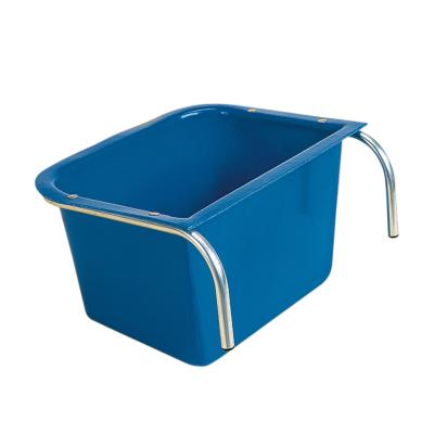 A blue portable manger made of metal with a plastic liner, featuring a handle on the side for equestrian stables. Manufactured by Stubbs Abbey England. Available at ice Equestrian Wukair Doha Qatar.
