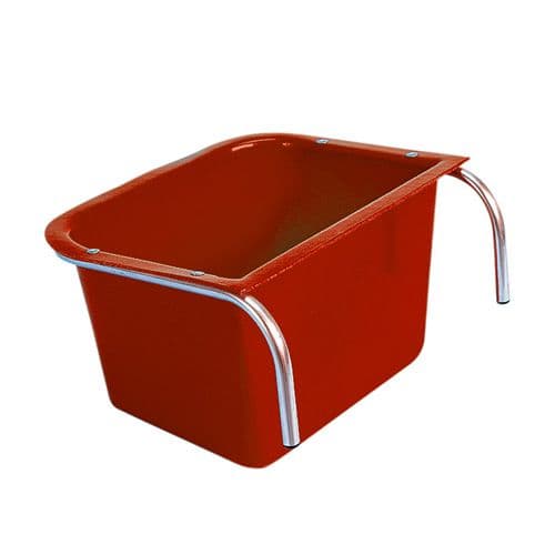 A red portable manger made of metal with a plastic liner, featuring a handle on the side for equestrian stables. Manufactured by Stubbs Abbey England. Available at ice Equestrian Wukair Doha Qatar.