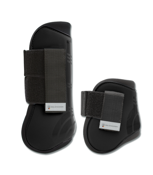 A set of black horse tendon and hind boots with Velcro fasteners.